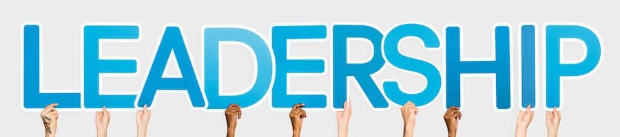 hands-holding-up-blue-letters-forming-word-leadership (1)